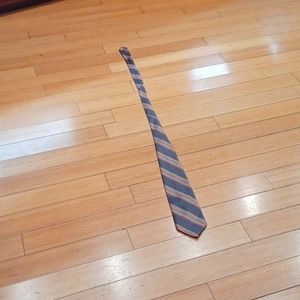 Chadwick wembley tie. Red gold blue gray